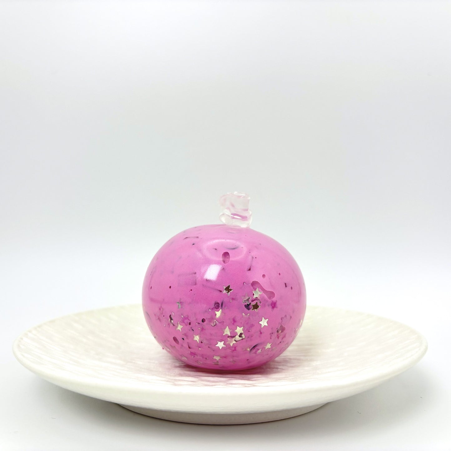 Cute black and pink stress ball with smooth matte texture