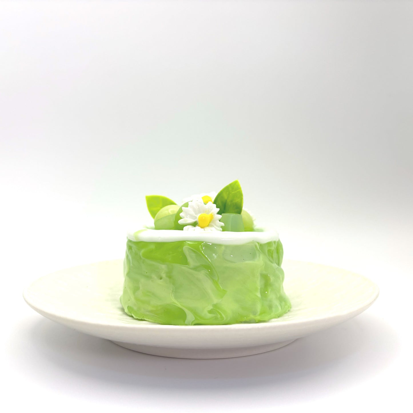 Front view of Lalachill’s Honeydew Melon Cake Squishy, featuring a refreshing honeydew melon cake design in soft silicone