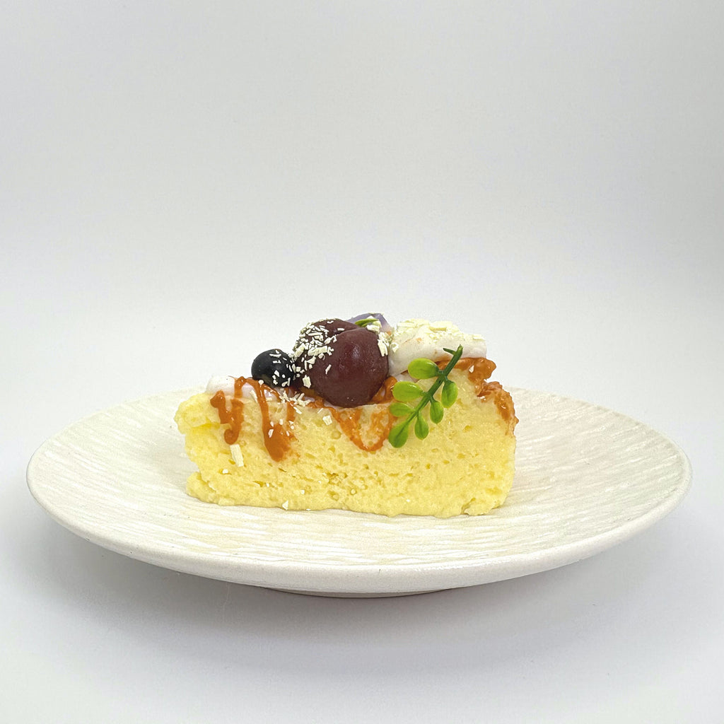 Front view of Lalachill’s Cheese Cherry Cake Squishy, featuring a realistic cheese and cherry cake design in soft silicone.”