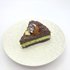 Front view of Lalachill’s Avocado  chocolate Cake Squishy, featuring a realistic avocado and raspberry cake design in soft silicone