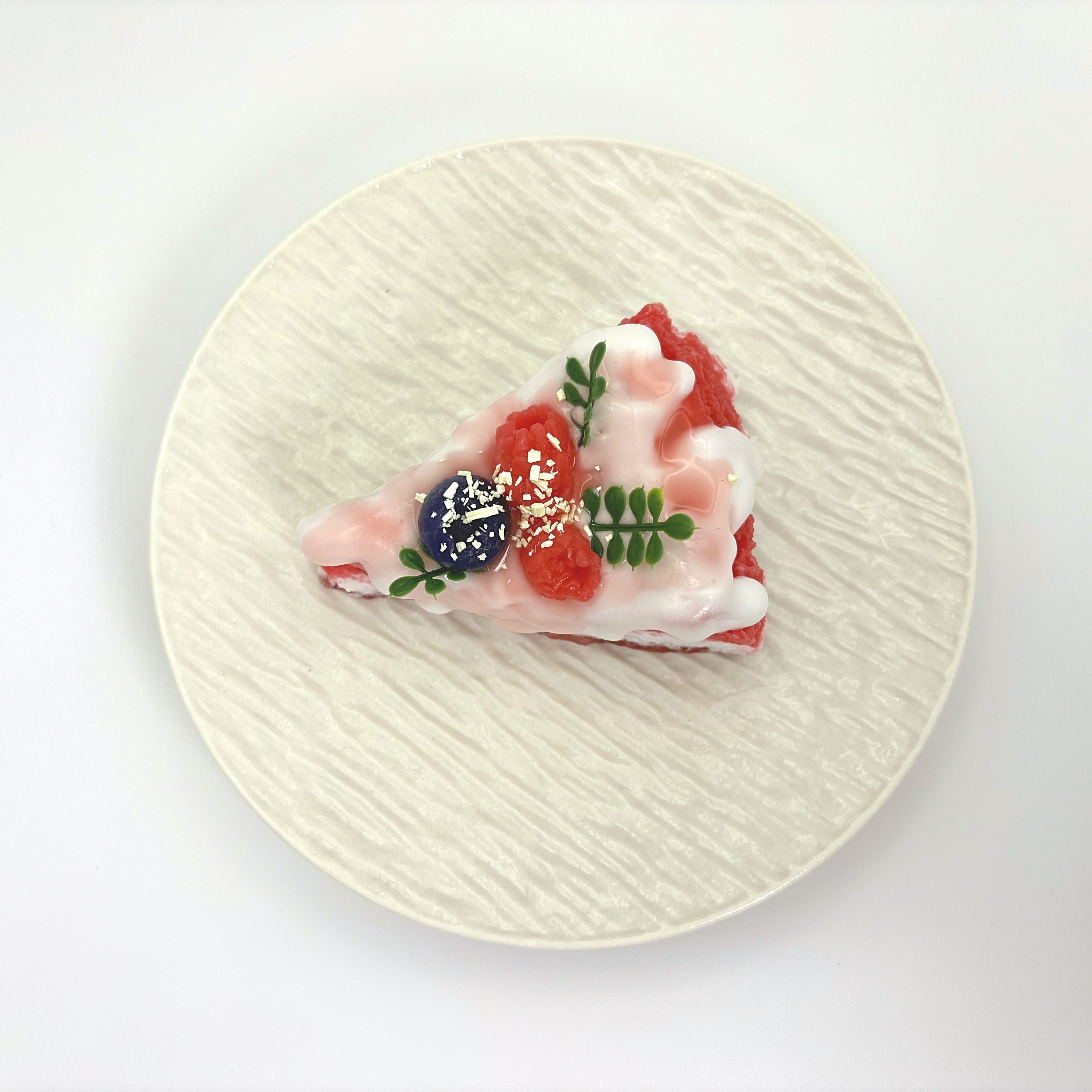 Top view of Lalachill’s Raspberry Cream Cake Squishy, showcasing its vibrant colors and smooth texture