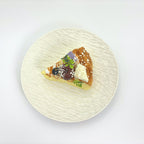 Top view of Lalachill’s Cheese Cherry Cake Squishy, showcasing its vibrant colors and smooth texture.