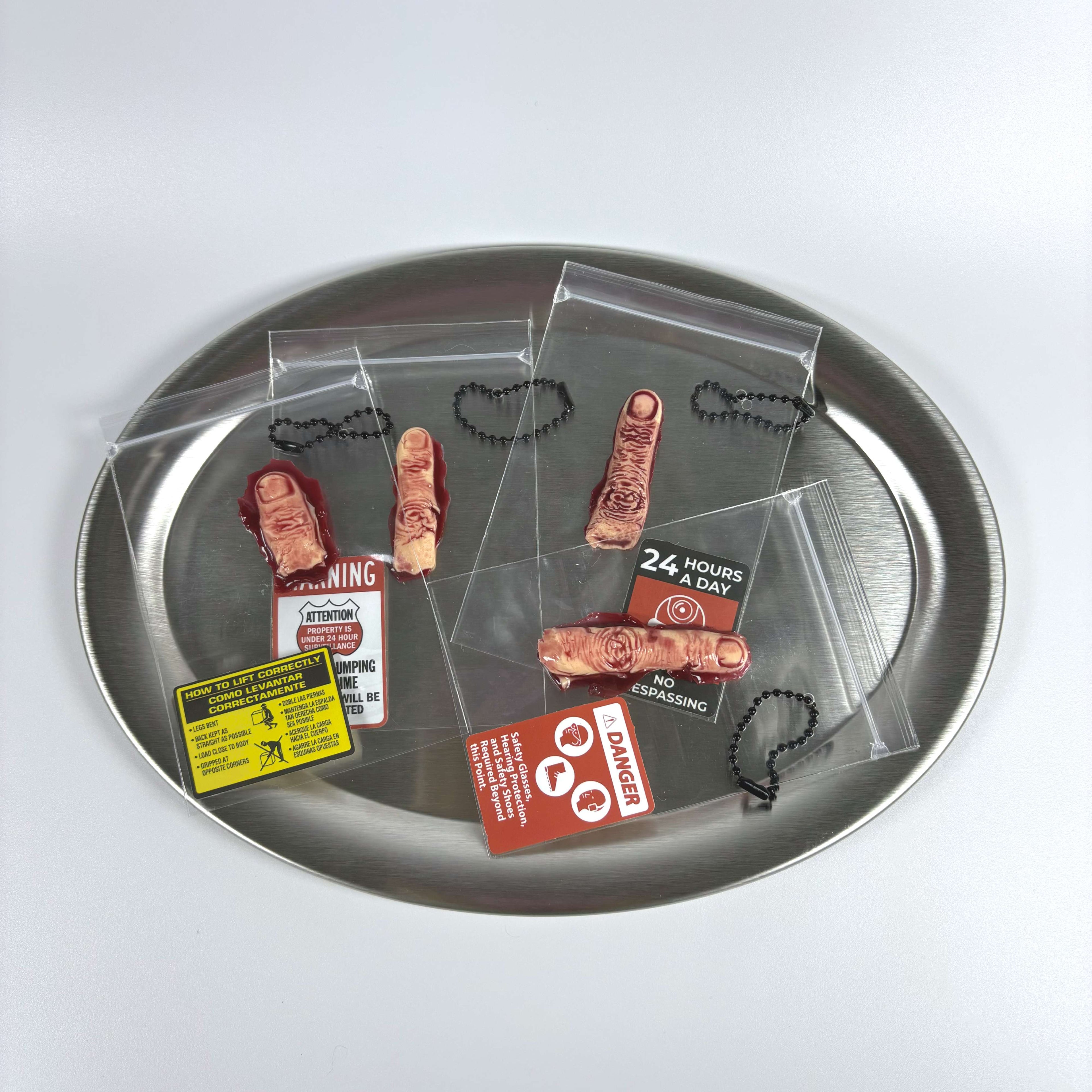 Front view of Lalachill’s Dark Art Squishy Set-fingers, showcasing four finger shaped squishy in a silver plate.