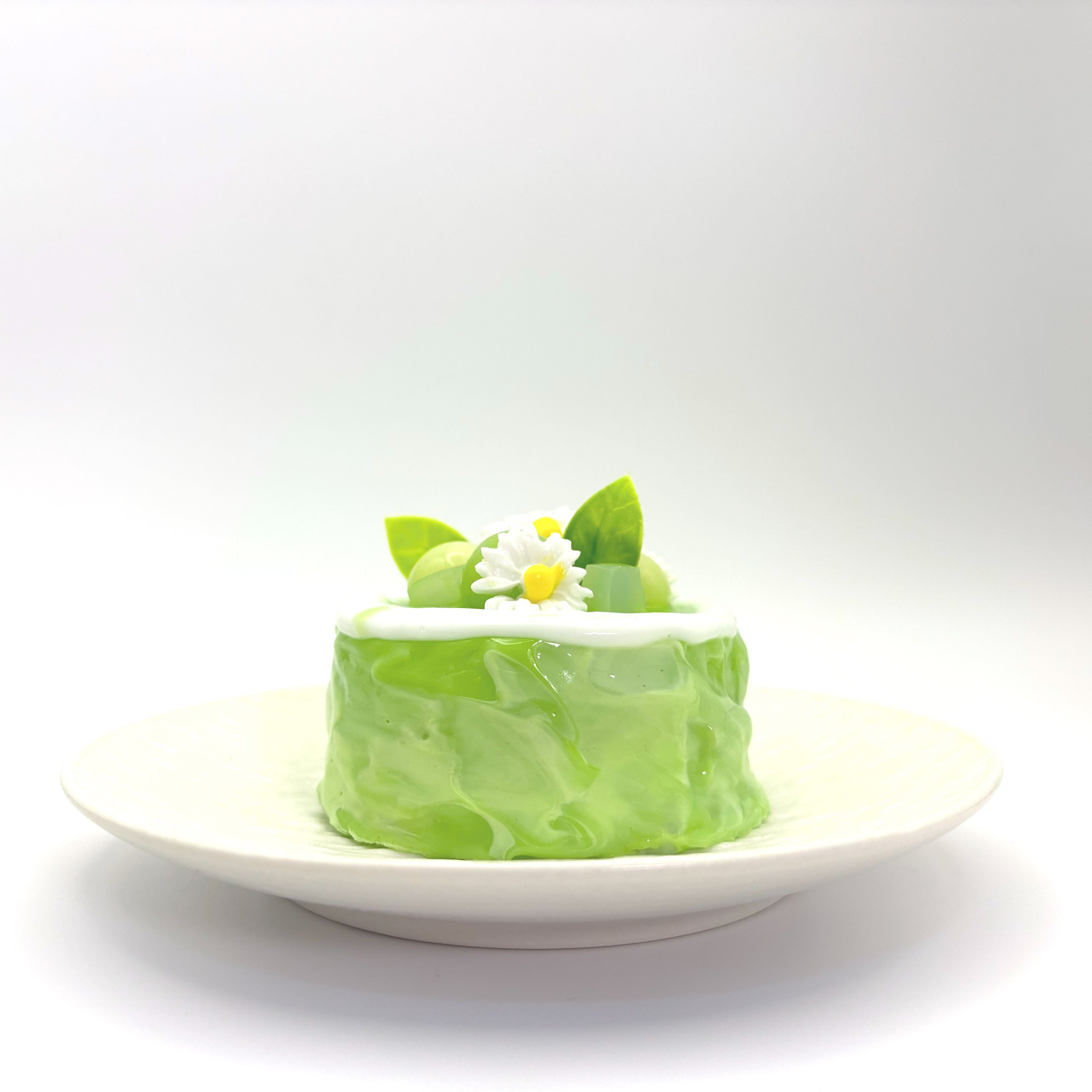 Front view of Lalachill’s Honeydew Melon Cake Squishy, featuring a refreshing honeydew melon cake design in soft silicone