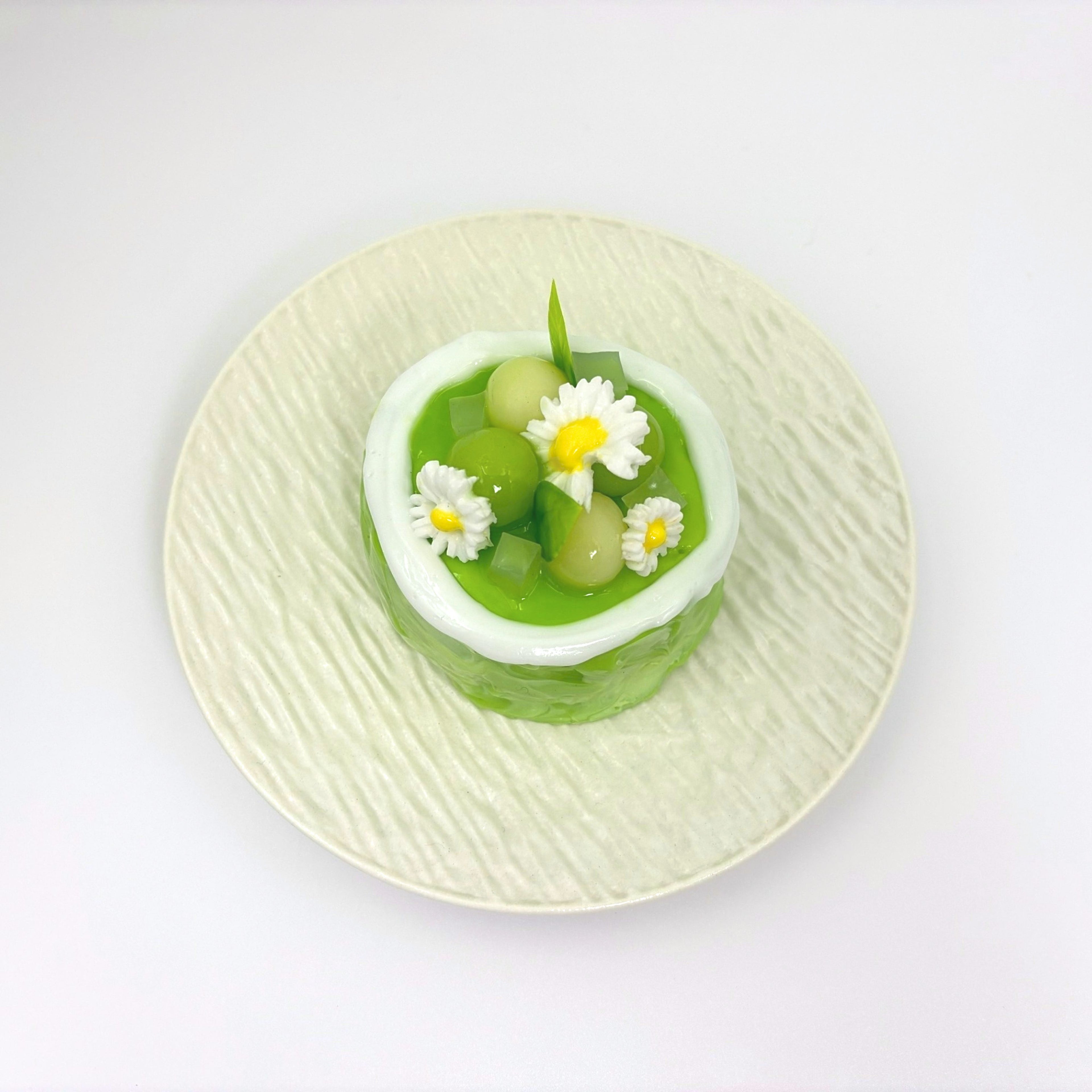 Top view of Lalachill’s Honeydew Melon Cake Squishy, showcasing its vibrant colors and smooth texture.