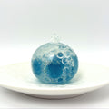 Lalachill Ocean Breeze stress ball in translucent blue with wave-like texture