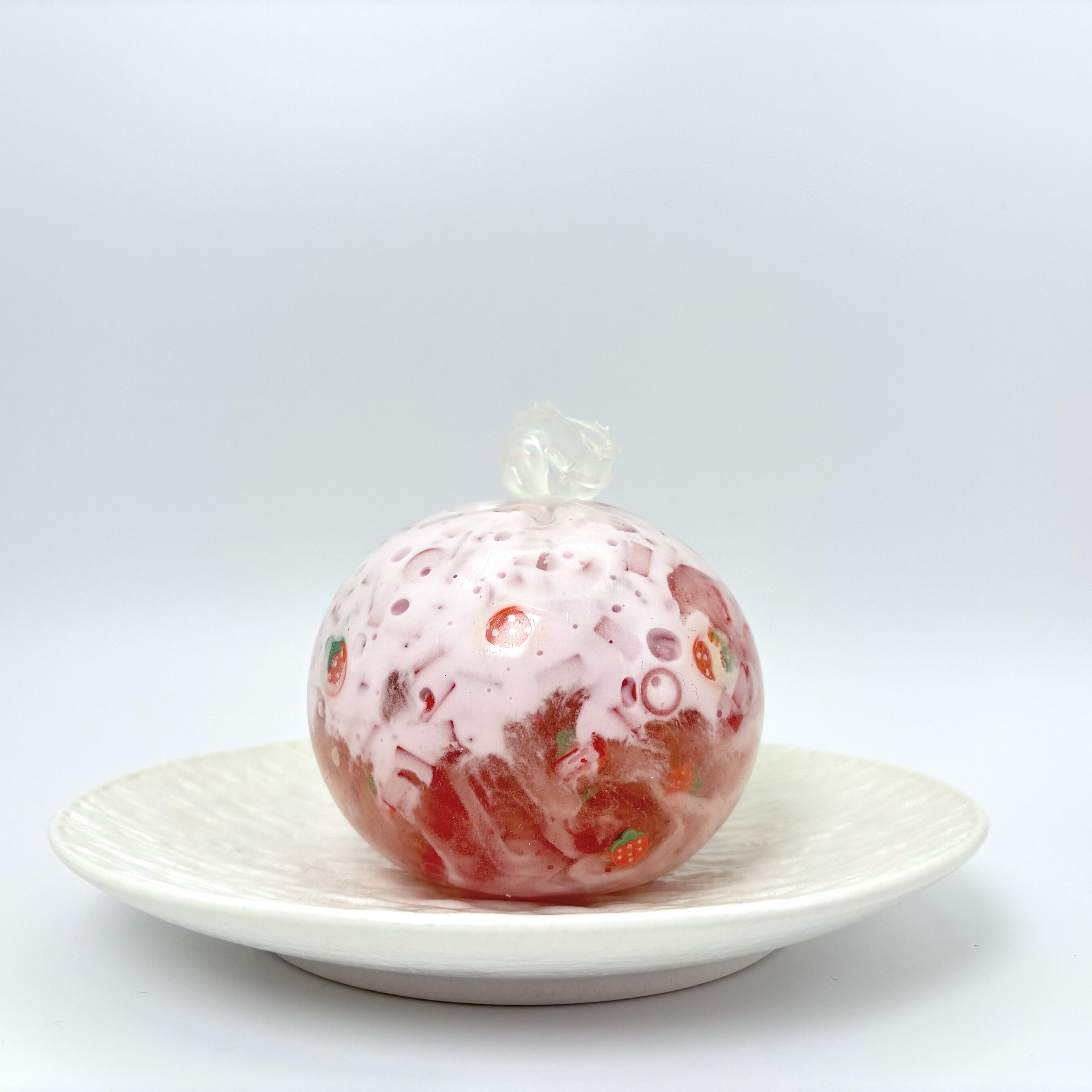 Lalachill Strawberry Slush stress ball in vibrant pink with glossy slush-like texture