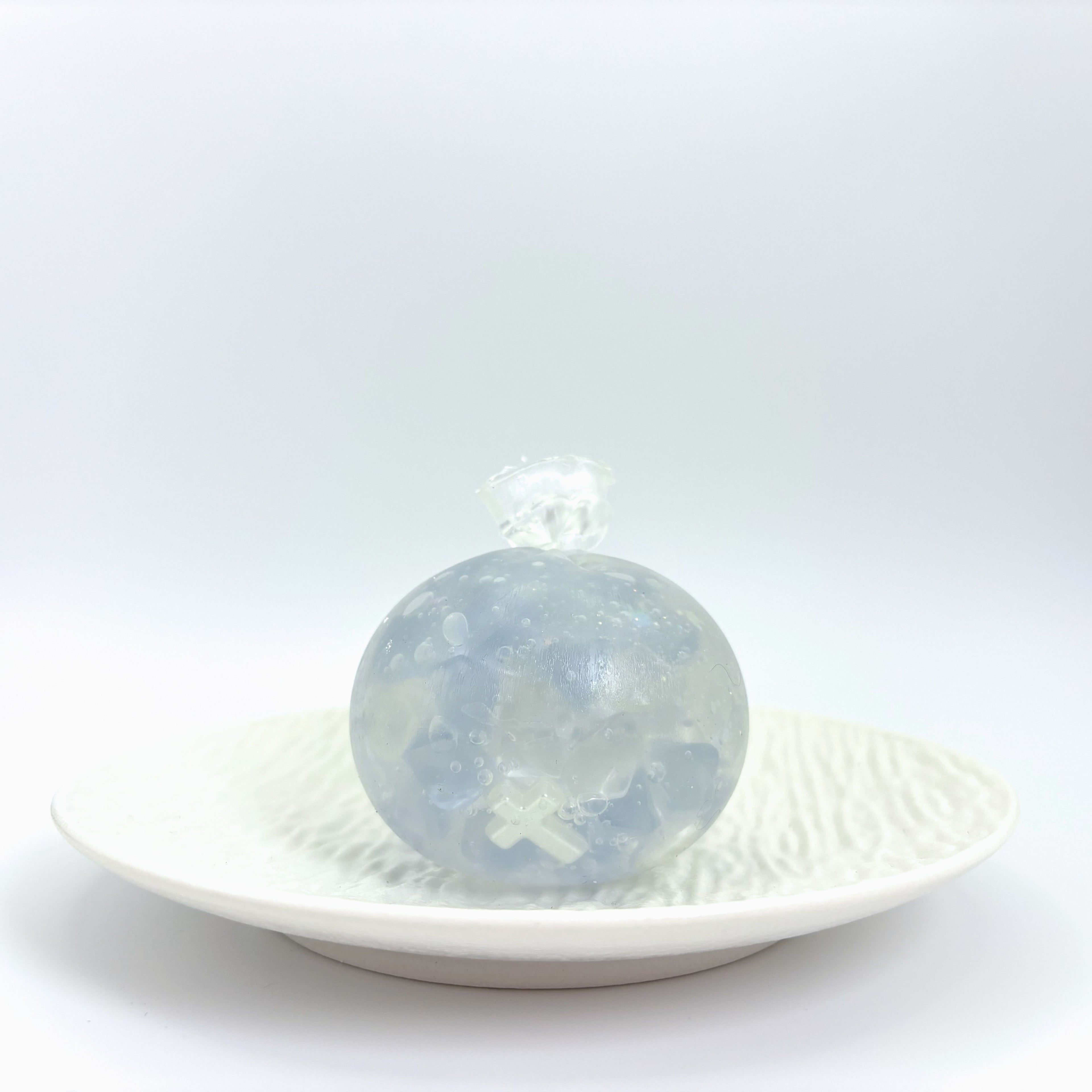 Front view of Lalachill's white moonlight asmr stress ball.