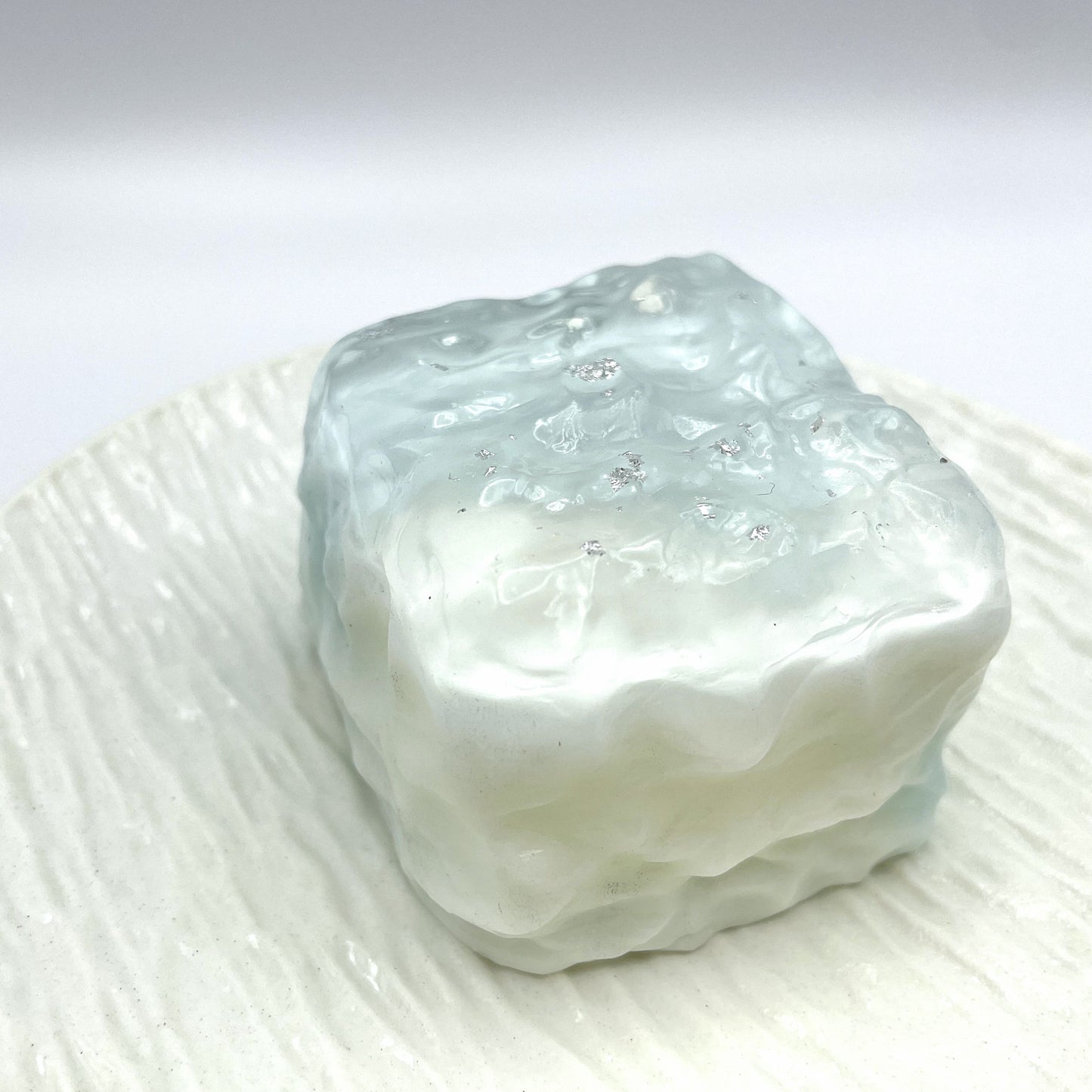 Aqua Wave Cube Taba Squishy closeup view with a soft blue and milky translucent design.