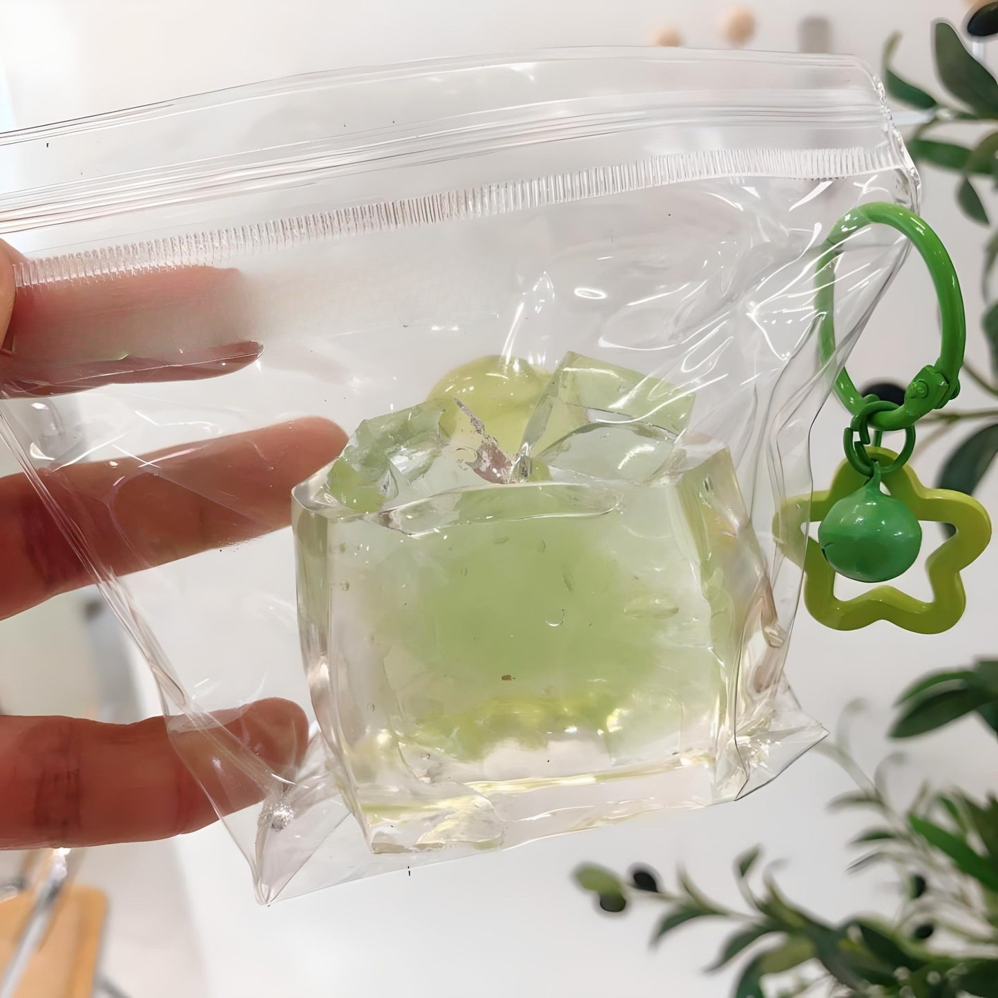 Green Grape Jelly Taba Squishy in a transparent bag, showcasing its clear and clean look.