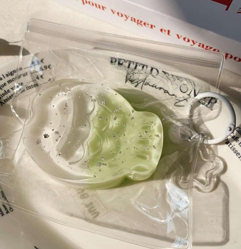 Jade Taiyaki Taba Squishy wrapped in a clear bag, showcasing its vibrant green hue and detailed fish design