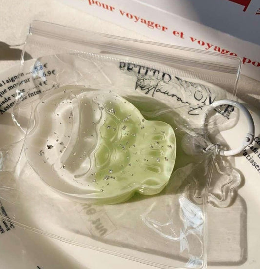 Jade Taiyaki Taba Squishy wrapped in a clear bag, showcasing its vibrant green hue and detailed fish design