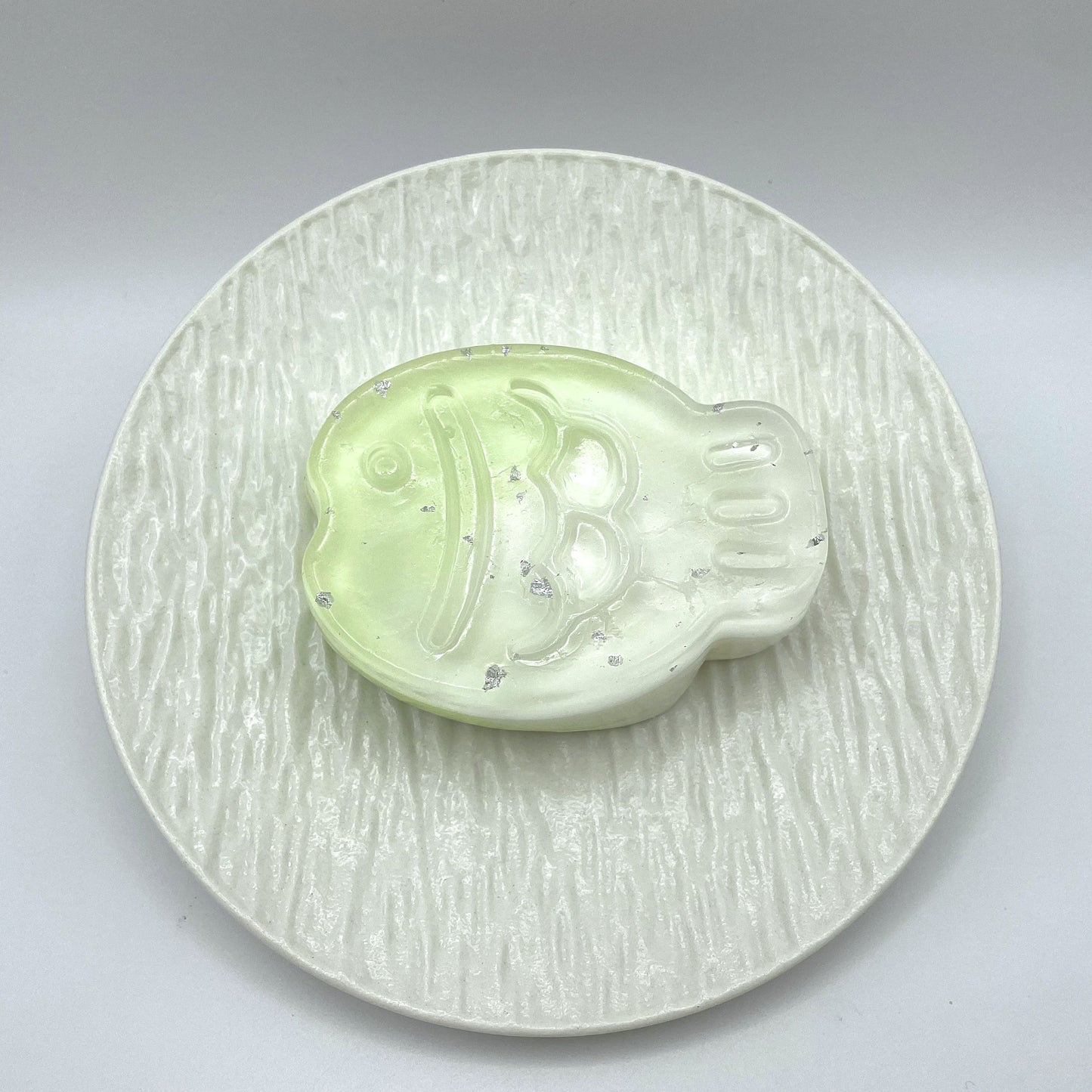 Top-down view of the Jade Taiyaki Taba Squishy, highlighting its textured scales and intricate taiyaki shape