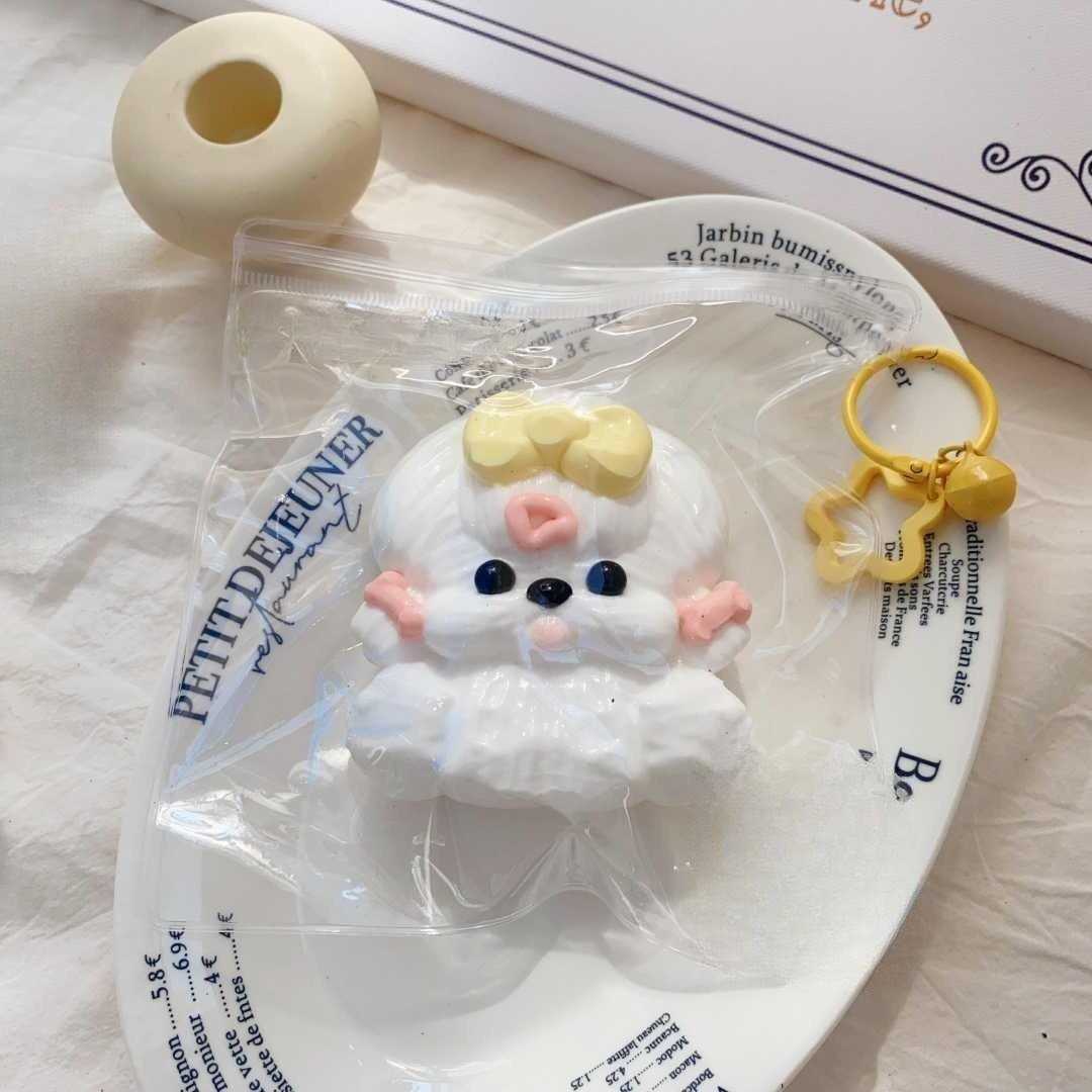 Top-down view of the Maltie Pup Taba Squishy neatly packed in a clear bag, showcasing its adorable Maltese design and soft texture.