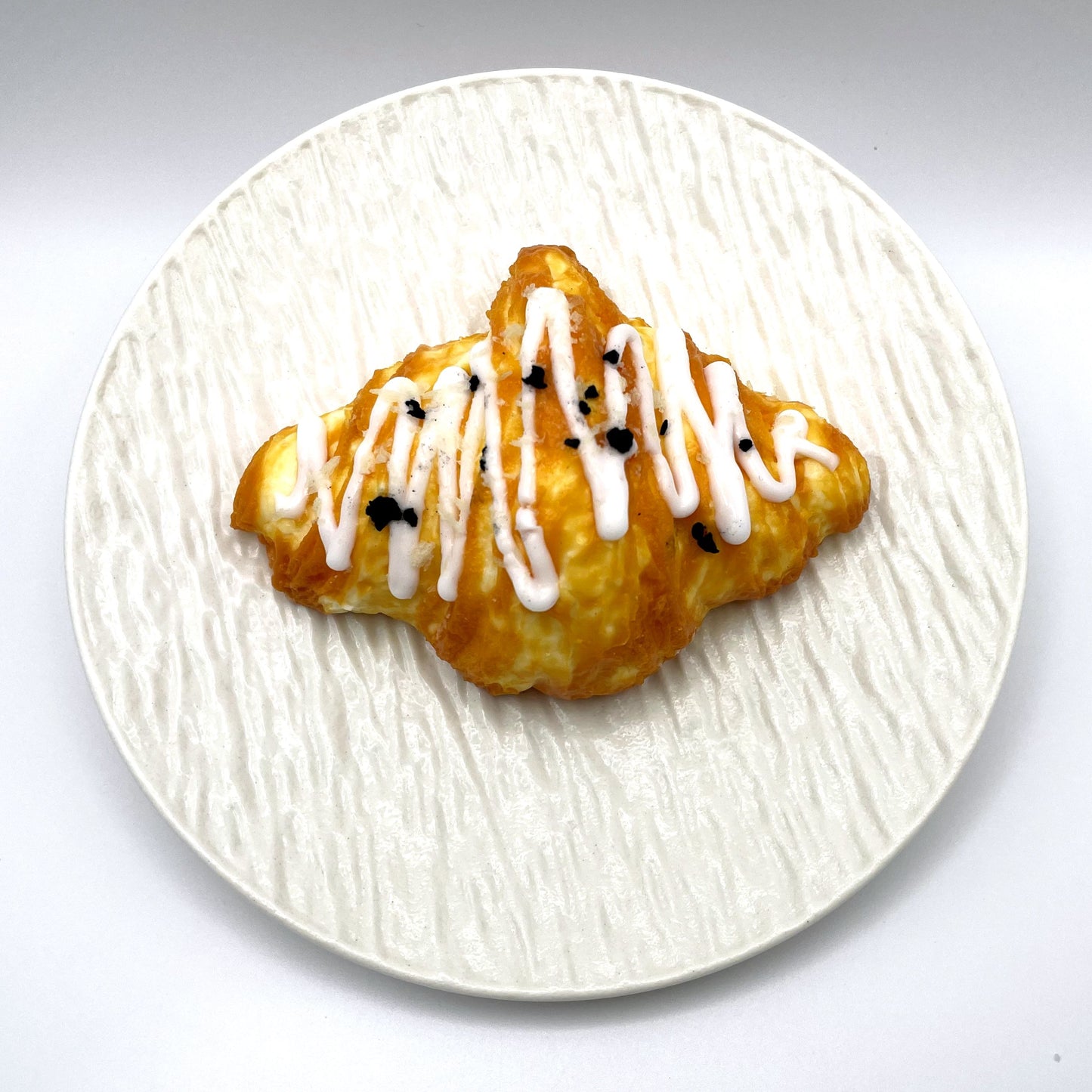 Not a Croissant Taba Squishy – Top view showing the detailed layers and perfect croissant shape with a squishy texture.