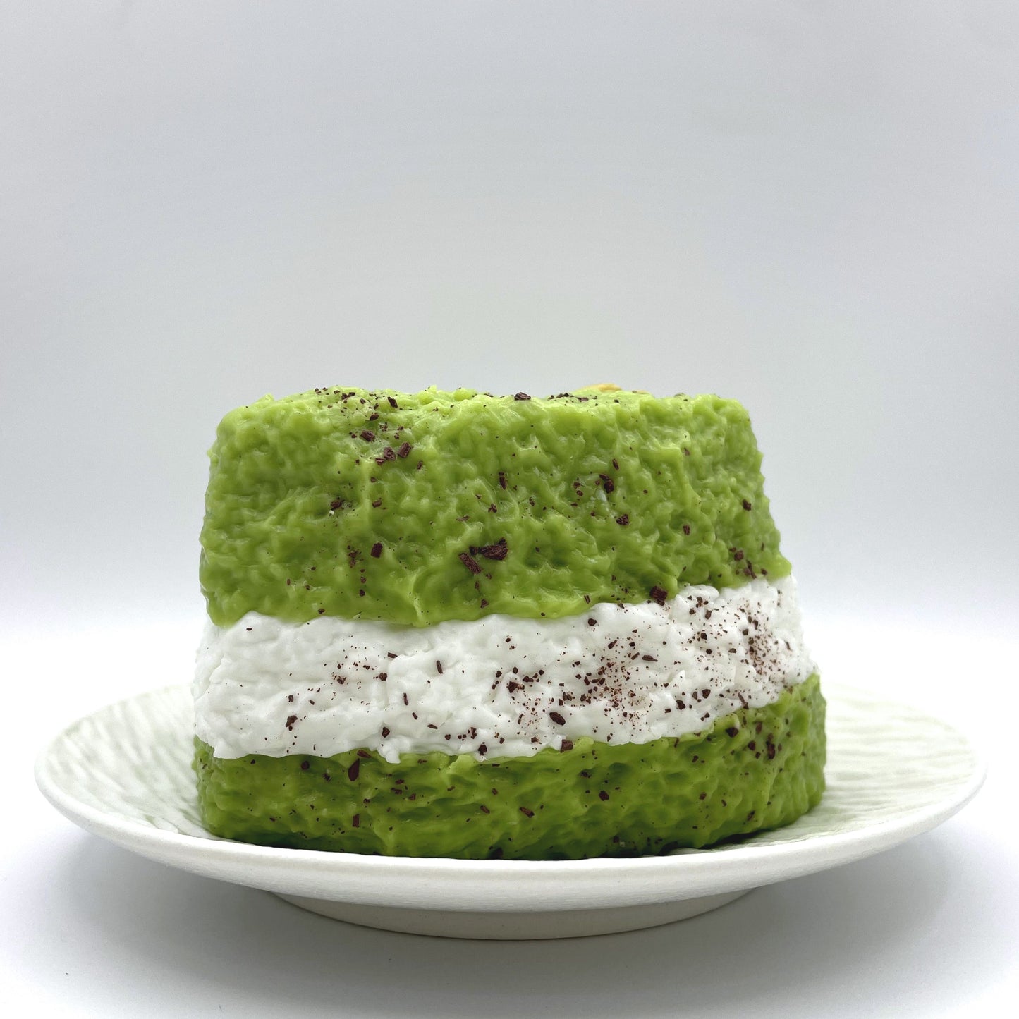 Front view of the Triple Matcha squishy, showcasing its realistic three-layer design in vibrant shades of green