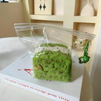 Triple Matcha squishy on a minimalist white desk, evoking a calm and cozy atmosphere.