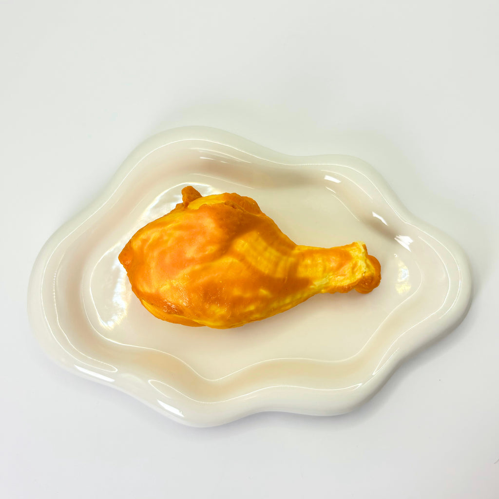 Realistic chicken leg squishy toy – Cheeky Leg by Lalachill Taba Squishy in top view.